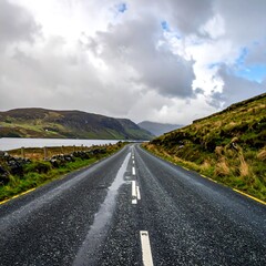 Scenic Road Through Irish Countryside on a Cloudy Day.