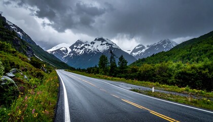 Fototapeta premium Scenic Road Through Mountain Landscape Under Stormy Skies.