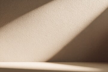 Textured wall and surface lit by a diagonal beam of warm light