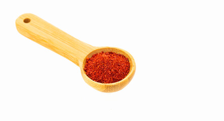 Organic ground or crushed annatto in the measuring spoon - Bixa Orellana