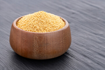 Amaranthus - Raw amaranth seeds in a wooden bowl