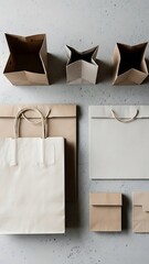 Minimalist arrangement of shopping bags on a gray concrete background