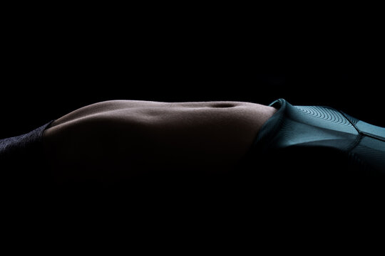 Elegant silhouette of a female basketball player highlighting muscle definition - Powered by Adobe