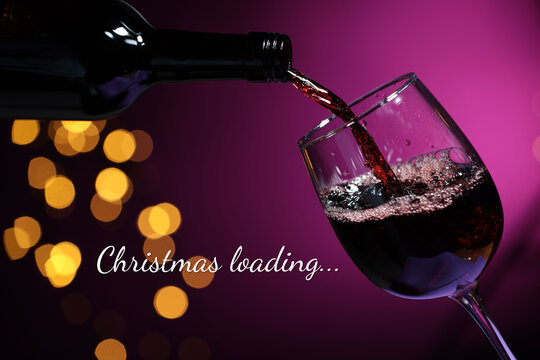 Christmas loading, holiday expectation. Pouring wine into glass against purple background with bokeh lights