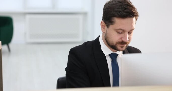 Guest giving passport to receptionist in hotel, closeup