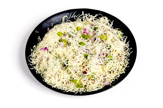 Bhakri pizza, an Indian street food like a pizza made with unleavened whole-wheat flatbread (bhakri) topped with Amul cheese isolated on white