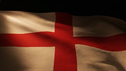 A fabric banner featuring a prominent red cross against a light background illuminated by uneven light and shadows