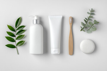 Organic skincare flat lay: white pump bottle, cream tube, bamboo toothbrush, soap stone, and natural green leaves.