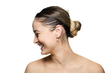 Portrait of a smiling woman with a bun, wearing earrings, side profile against a white background for lifestyle and fashion stock use