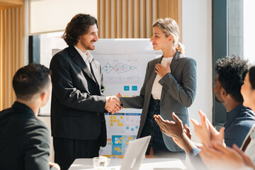 Business team showing unity success with hands together in office, teamwork collaboration and power motivation, diverse colleagues celebrating achievement corporate goal partnership