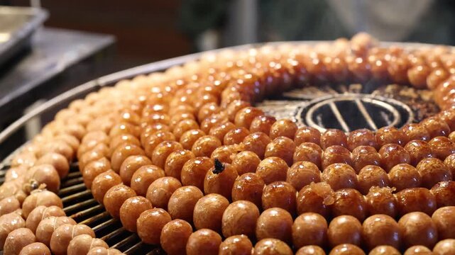 Grilling Thai Sai Krok Isan Sausage Balls at Night Market