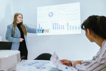 Business team analyzing data and marketing strategy in modern office, brainstorming ideas for project success using laptops and charts, teamwork collaboration for corporate growth