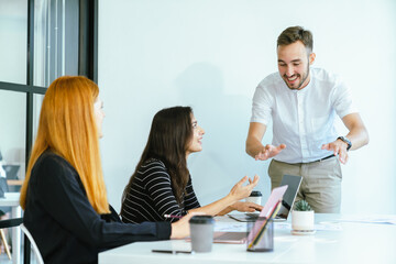 Business team analyzing data and marketing strategy in modern office, brainstorming ideas for project success using laptops and charts, teamwork collaboration for corporate growth