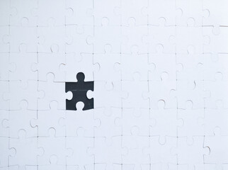 Jigsaw puzzle with one piece missing