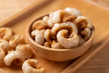 Pork rind in a wooden bowl, Northern Thai food