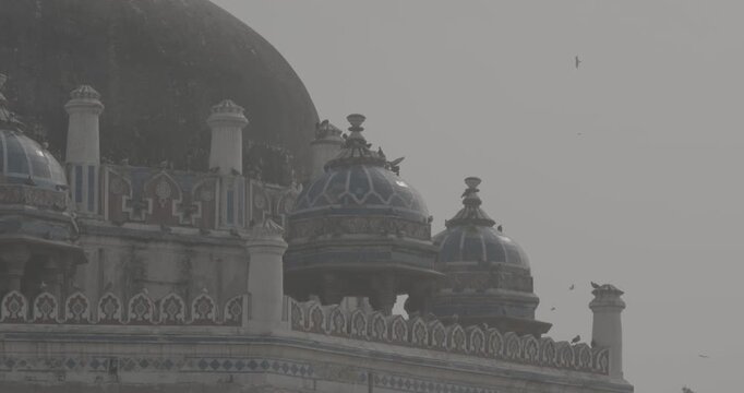 New Delhi, Delhi, India. Doves birds sitting on Isa Khan's Tomb near The Humayun's tomb. Famous place is Tomb of Mughal emperor, Mirza Nasir al-Din Muhammad commonly known as Humayun situated in Delhi