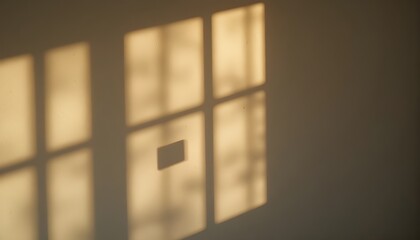 Warm diffused glow creating gentle shadows on a white wall