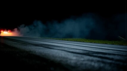Dynamic night car scene with smoke and lights, perfect for automotive and racing themes