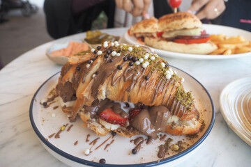 roissant dessert with chocolate and fruits on a plate