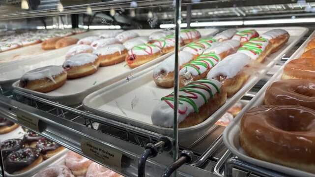Doughnuts and Bagels in Grocery Store Display Cabinet 