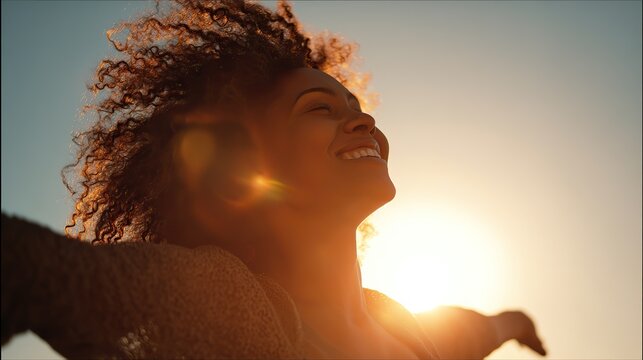 A joyful Black woman with curly hair, embracing the golden sunset with arms open wide, her silhouette backlit by sunlight flares, evoking the freedom and joy of Africa's Day of Freedom.