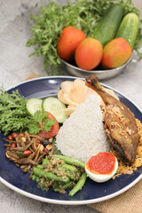 Nasi Uduk Platter with Fried Duck, Rice, and Side Dishes
