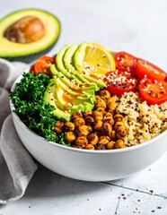 Healthy and Delicious Vegan Buddha Bowl with Quinoa, Chickpeas, Avocado, and Fresh Vegetables.