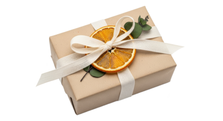 A wrapped gift with a dried orange slice and green leaves tied with a white ribbon.