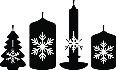 Set of four black silhouette candles with white snowflake designs
