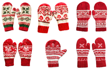 A collection of red and white knitted mittens with a festive, holiday-themed pattern.
