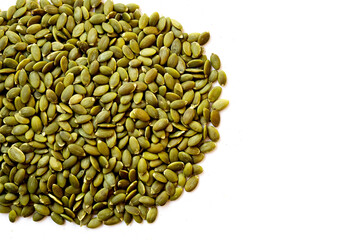 Obraz premium Delicious peeled green pumpkin seeds