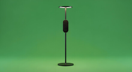 Modern minimalist black floor lamp with integrated speaker and ambient light against a vibrant green background.