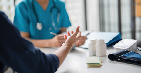 A patient explaining to a doctor.
