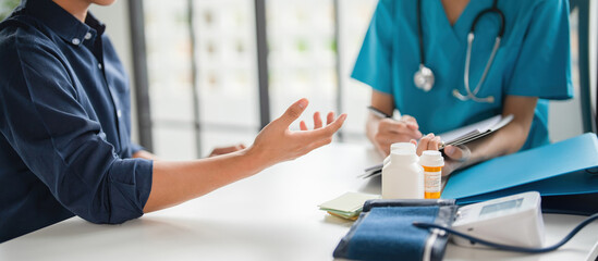 A patient explaining to a doctor.