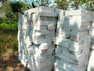 Piles of broken blocks form art. White bricks for building a house. Selective focus.
