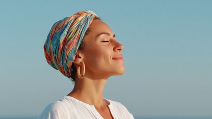 Woman meditating at beach sunset