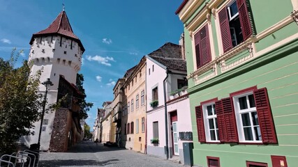 Charming Sibiu street with Turnul Olarilor, sunny day, calm ambiance