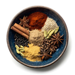 Assortment of whole and ground spices in a rustic bowl