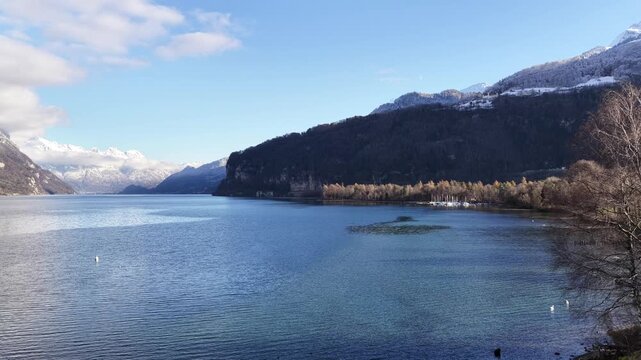 aerial view of walensee lake and surrounding alpine villages in switzerland
