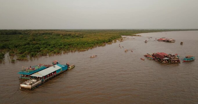Aerial view of floating platforms and boats near the mangrove edge of Tonle Sap Cambodia