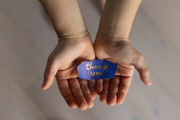thank you, child hands holding paper with thanks appreciation message, gratitude concept