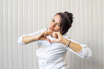 Confident Entrepreneur in Chef Coat Showing Love for Her Craft