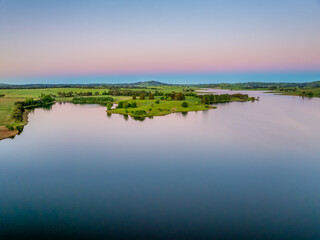 Fototapeta premium Clear Sky Soft Pink Sunset Over Carcoar Dam