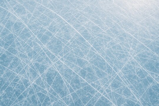 Close up of scratched ice surface background with crisscrossing skate marks and frosty textures, winter sport textures