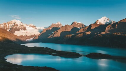 A serene alpine lake surrounded by snow-capped mountains under a clear blue sky