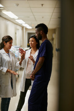 Healthcare, doctor and nurse in hospital for discussion, consulting and planning. Team, communication and medical professional with people for advice, compliance or training for surgery in clinic