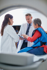 Mri machine, patient or doctors with tablet for test results, discussion or medical referral for...