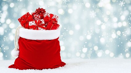 Red santa bag full of festive gifts on snowy bokeh background