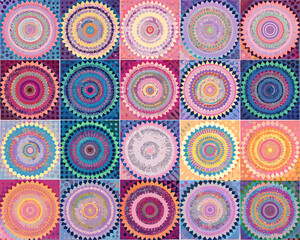 A colorful grid of circular patterns and vibrant concentric designs