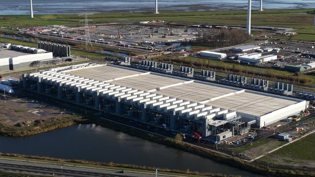 Aerial drone video of a hyperscale data center in Eemshaven, The Netherlands, highlighting internet services, big-data processing power, and large-scale digital infrastructure.